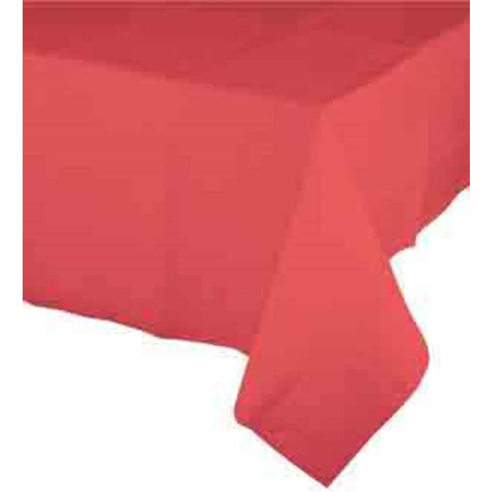 Coral-colored rectangular tablecloth draped over table with smooth texture.