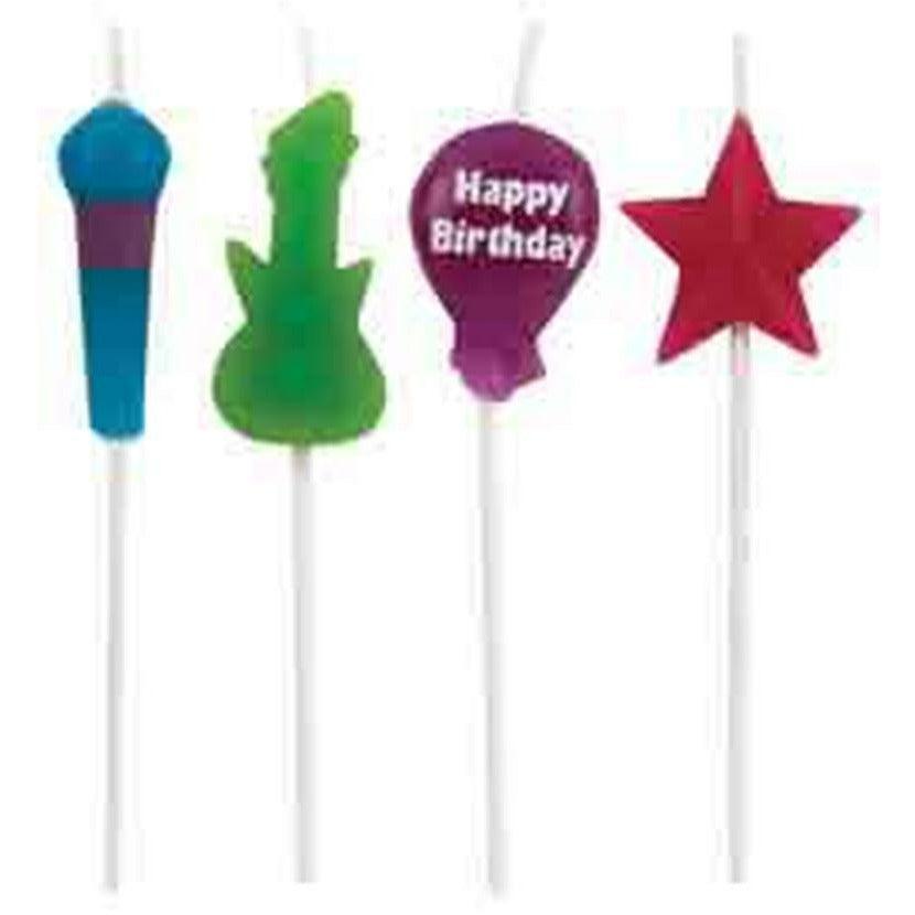 Colorful cake candles shaped like a blue microphone, green electric guitar, purple balloon with "Happy Birthday," and red.