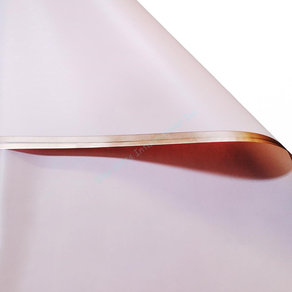 Soft rose pink floral wrapping paper with shiny gold edges, smooth and lightweight sheet.