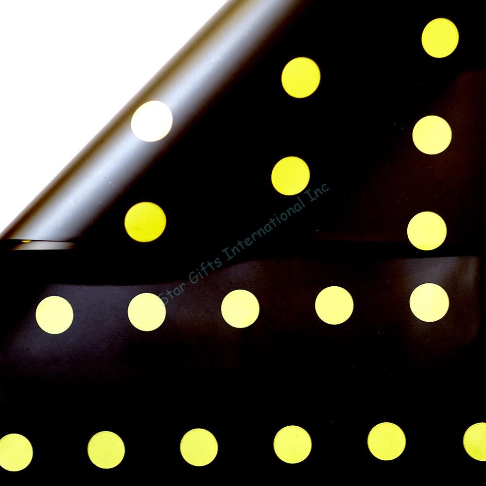 Black wrapping paper with evenly spaced gold metallic dots in a glossy finish.