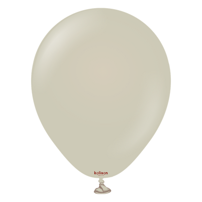 Glossy light beige latex balloon inflated with tied neck and small red "kalisan" logo near the bottom.
