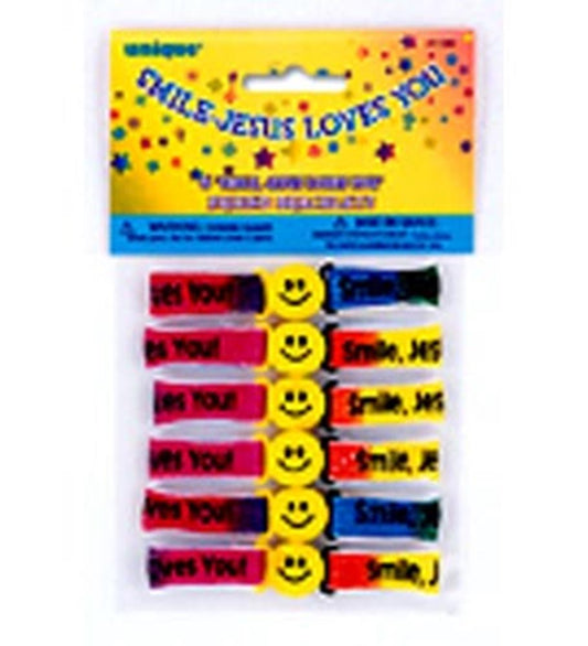 Six colorful silicone bracelets with smiley faces and positive phrases in red, yellow, blue, and black colors.