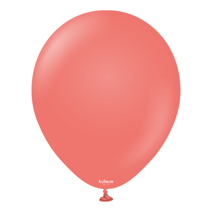 Coral-colored round latex balloon inflated, smooth surface, tied at the bottom.