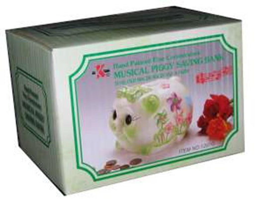 Large green ceramic piggy bank with floral patterns and musical feature packaging box.