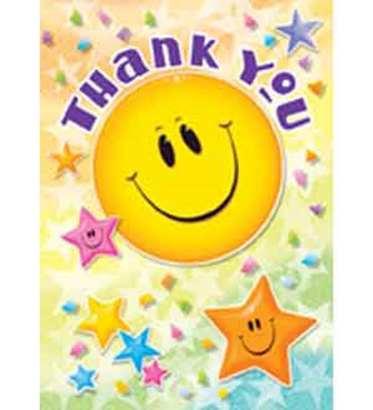 Bright yellow smiley face cake decoration with colorful star shapes and "Thank You" text in purple letters.