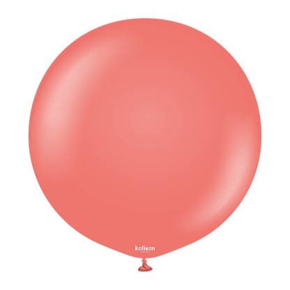 Large round coral-colored balloon with a smooth, shiny surface and a small tied end at the bottom.
