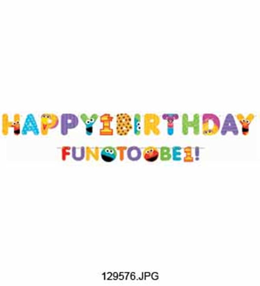 Colorful illustrated letter banner spelling "Happy 1st Birthday" with playful designs and Sesame Street characters below.