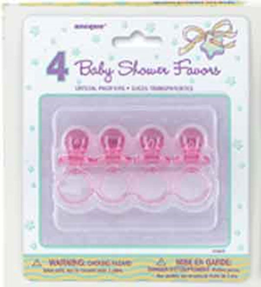 Set of four pink 2-inch crystal pacifier-shaped baby shower favors in clear plastic packaging.