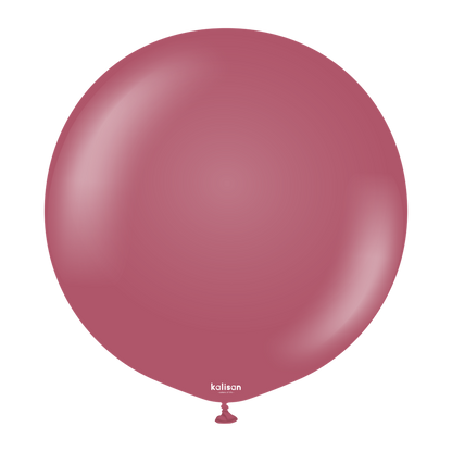 Large round balloon in solid muted wild berry color with a smooth, glossy finish and small tied end.