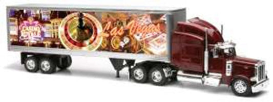 Maroon Peterbilt 379 semi-truck with detailed Las Vegas-themed trailer featuring colorful cityscape and bright neon signs.