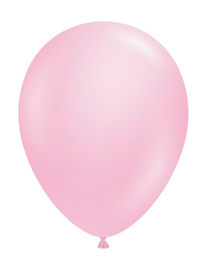 Single pastel pink latex balloon inflated with a round shape and tied end.