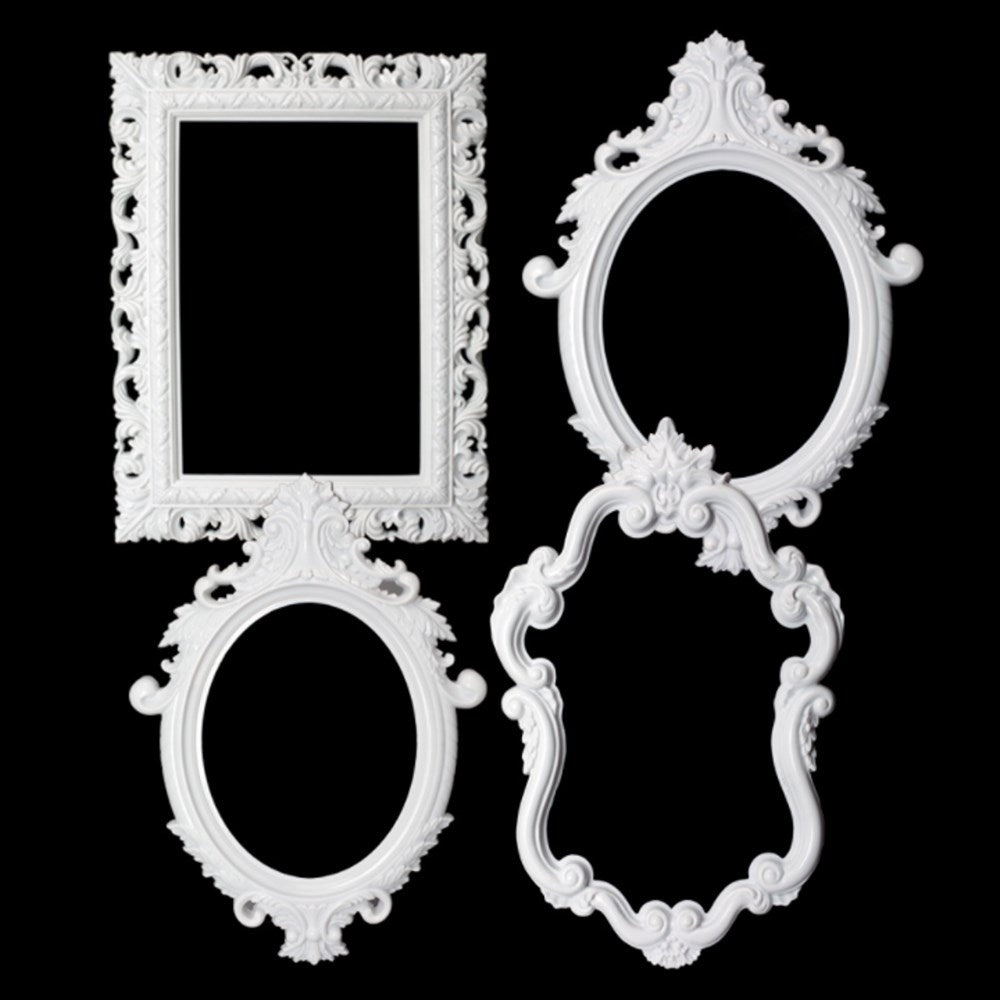 Set of three ornate white plastic frames with intricate floral and scroll designs in rectangular and oval shapes.