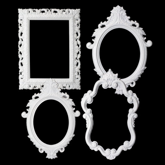 Set of three ornate white plastic frames with intricate floral and scroll designs in rectangular and oval shapes.