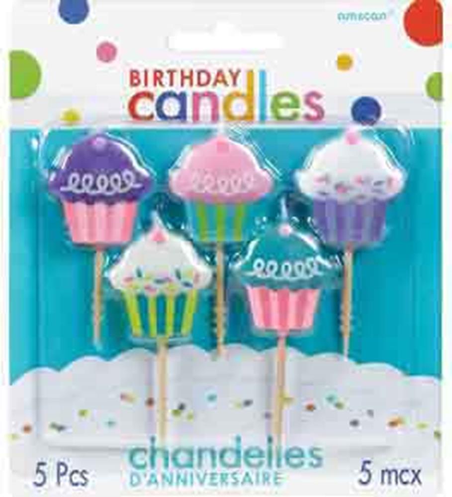Five colorful cupcake-shaped birthday candles with molded frosting and sprinkles on white sticks in packaging.