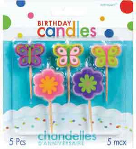 Set of five birthday candles shaped like colorful butterflies and flowers on white sticks.