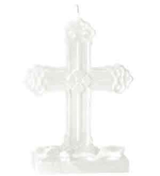 White decorative cross-shaped candle with floral accents and a wick at the top.