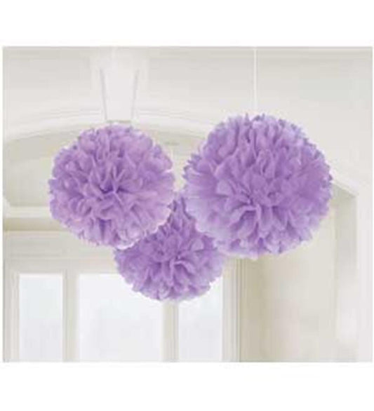 Three lilac fluffy tissue paper pom-poms hanging from white strings for party decor.