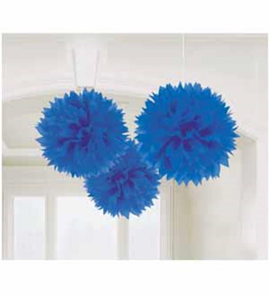 Three bright royal blue fluffy paper pom-pom decorations hanging from the ceiling.