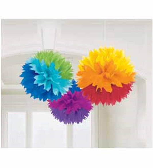 Three fluffy tissue paper pom-poms in rainbow colors with layered green, blue, purple, red, orange, and yellow petals.