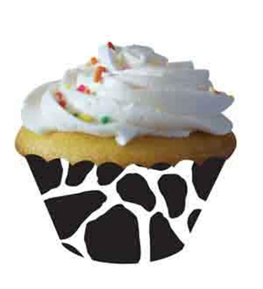 Cupcake wrapper with black and white cow print pattern on paper.