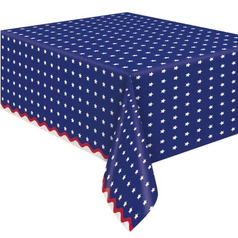 Blue rectangular paper table cover with white stars pattern and red scalloped edges.