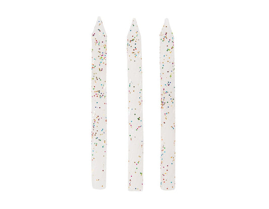 Set of three white birthday candles with spiral grooves and multicolored glitter accents.