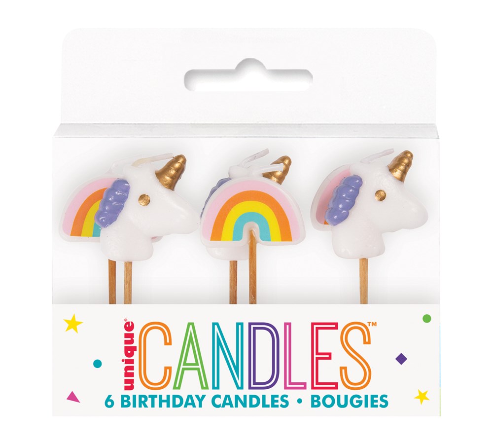 Set of six pink birthday candles featuring white unicorns with golden horns and rainbows.
