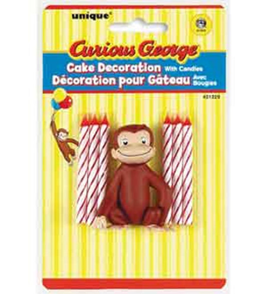 Curious George figure cake decoration with four red and white striped birthday candles on yellow striped backing.