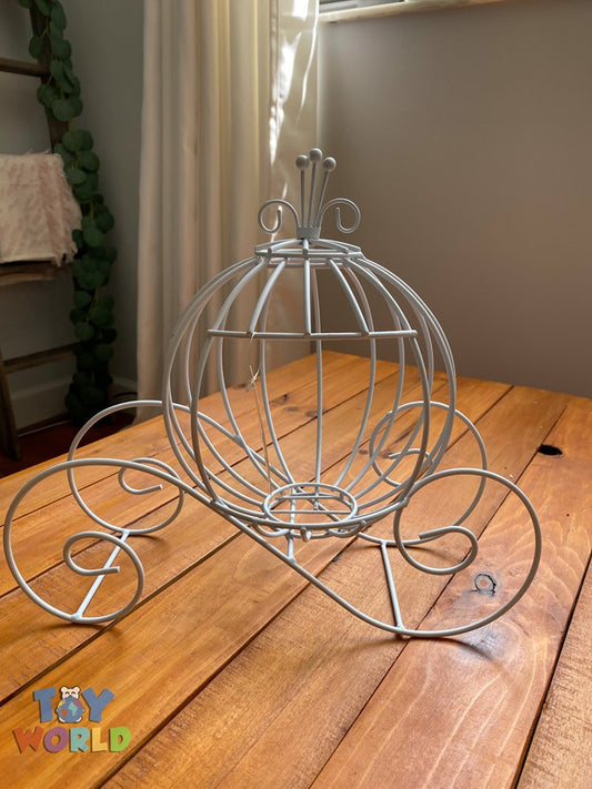 White metal pumpkin-shaped carriage with wireframe design and decorative scroll wheels.