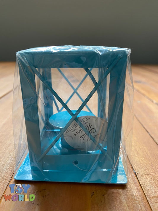 Blue metal candle cage with diamond lattice design and cylindrical shape on square base.