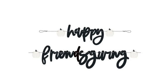 Black script "Happy" and "Thanksgiving" banner letters on a white string with small white turkey shapes.
