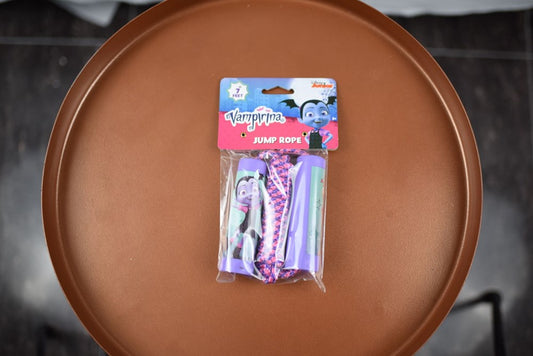 Vampirina-themed jump rope in pink and purple with character graphics on handles and packaging.