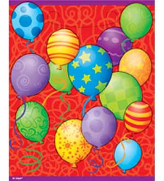Colorful birthday balloons in assorted patterns including stars, stripes, and polka dots on an orange background.