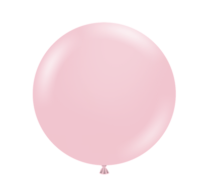 Large round pale pink latex balloon fully inflated with a glossy finish and tied end.