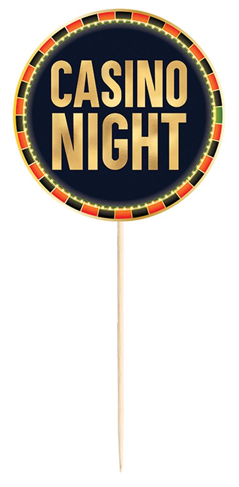 Round black casino night sign with gold lettering and a border of red, black, and gold poker chips on a stick.