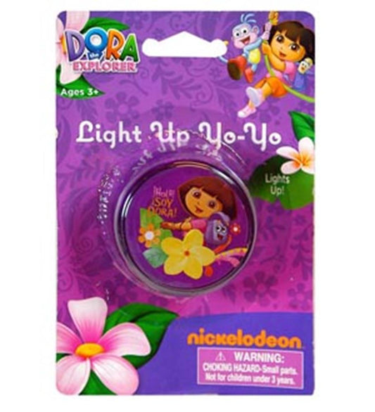 Purple plastic yo-yo featuring Dora the Explorer with yellow flowers, packaged on a purple card with floral designs.