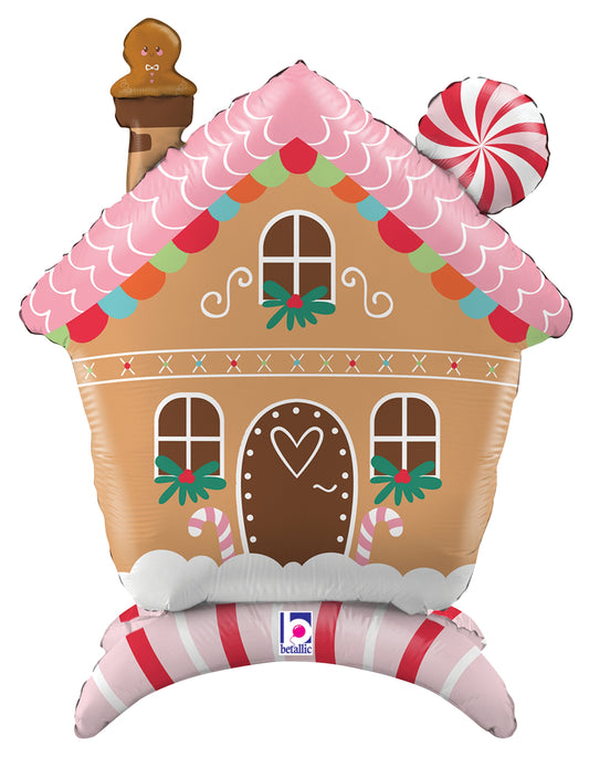 30-inch gingerbread house foil balloon with pink frosting roof, candy cane base, and peppermint swirl detail.