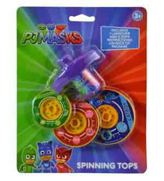 Set of three colorful PJ Masks-themed plastic spinning tops in purple, green, red, and blue packaging with cartoon character