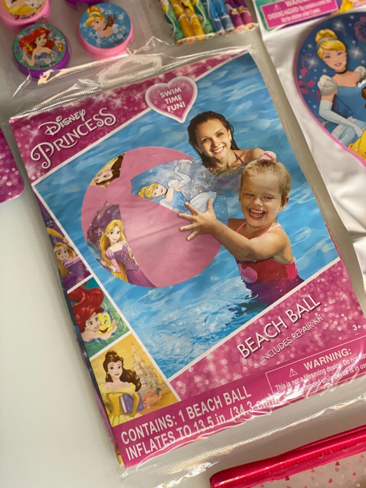 Pink inflatable beach ball with Disney princesses printed, including Cinderella and Belle, designed for kids' pool play.