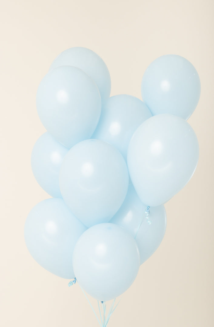 Cluster of light blue, round latex balloons inflated to 11 inches with helium.
