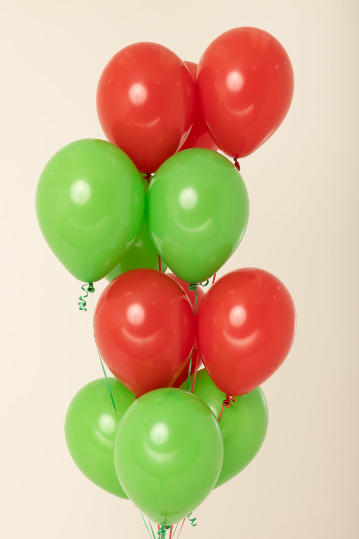 Cluster of shiny red and green 11-inch helium-filled latex balloons arranged evenly in alternating colors.