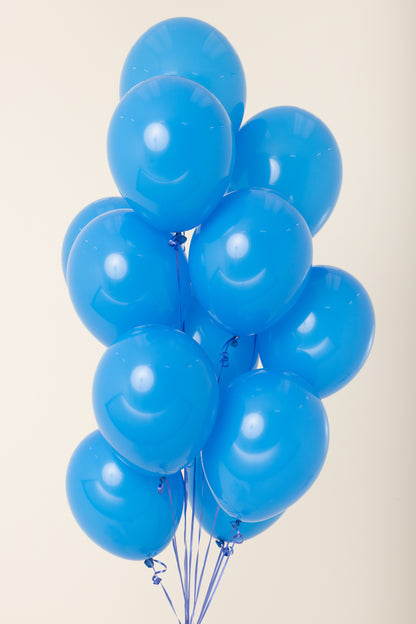 Cluster of nine shiny blue 11-inch latex helium balloons tied together with blue strings.