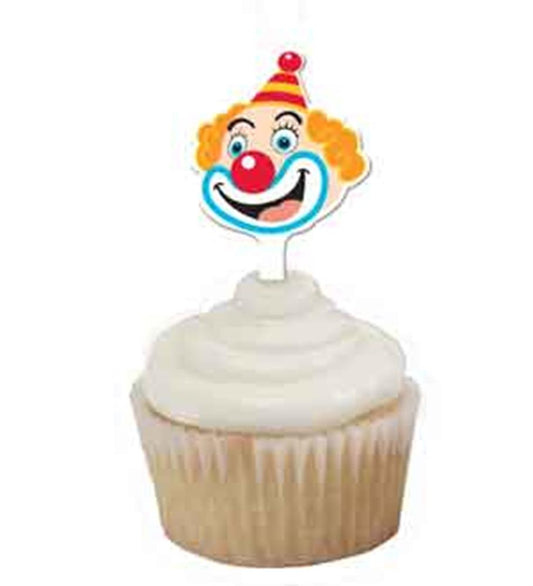 Colorful clown cupcake topper with red nose, orange hair, and striped party hat on vanilla cupcake with white frosting.