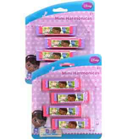 Four pink plastic mini harmonicas with colorful Doc McStuffins-themed labels on blister pack cards with purple polka dot.