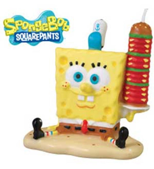 Yellow SpongeBob SquarePants candle holding a red and green spatula, cartoon character design.