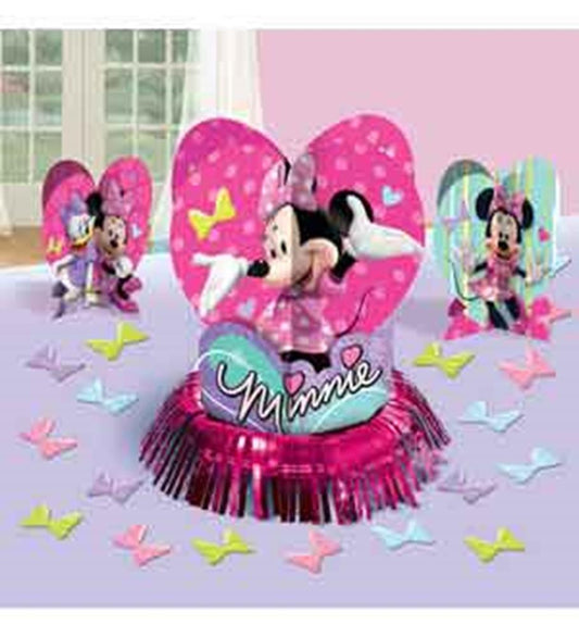 Pink and purple Minnie Mouse table centerpiece with large bow and "Minnie" text, surrounded by colorful paper butterflies.