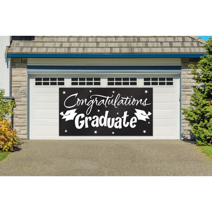 Large black graduation banner with white "Congratulations Graduate" lettering and decorative stars and caps.