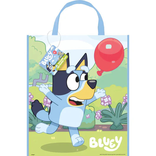 Bluey tote bag with colorful cartoon dog holding a red balloon on green grassy background, light blue handles.