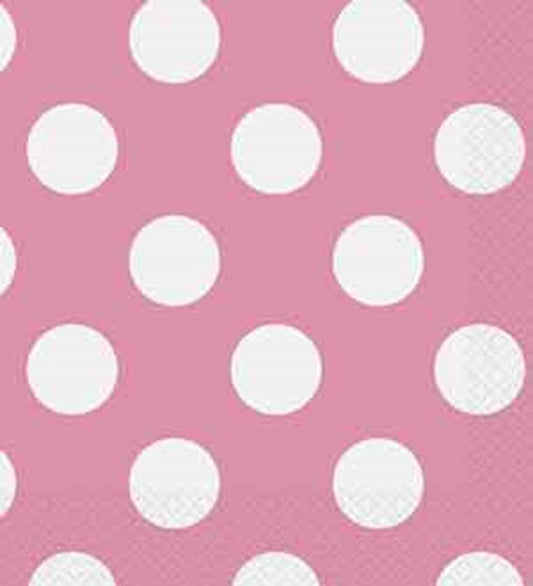 Hot pink paper napkin with evenly spaced large white polka dots, textured edges.