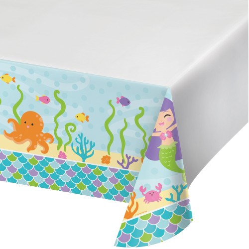 White tablecover with colorful sea creatures, mermaid, coral, and scale patterns on edges.